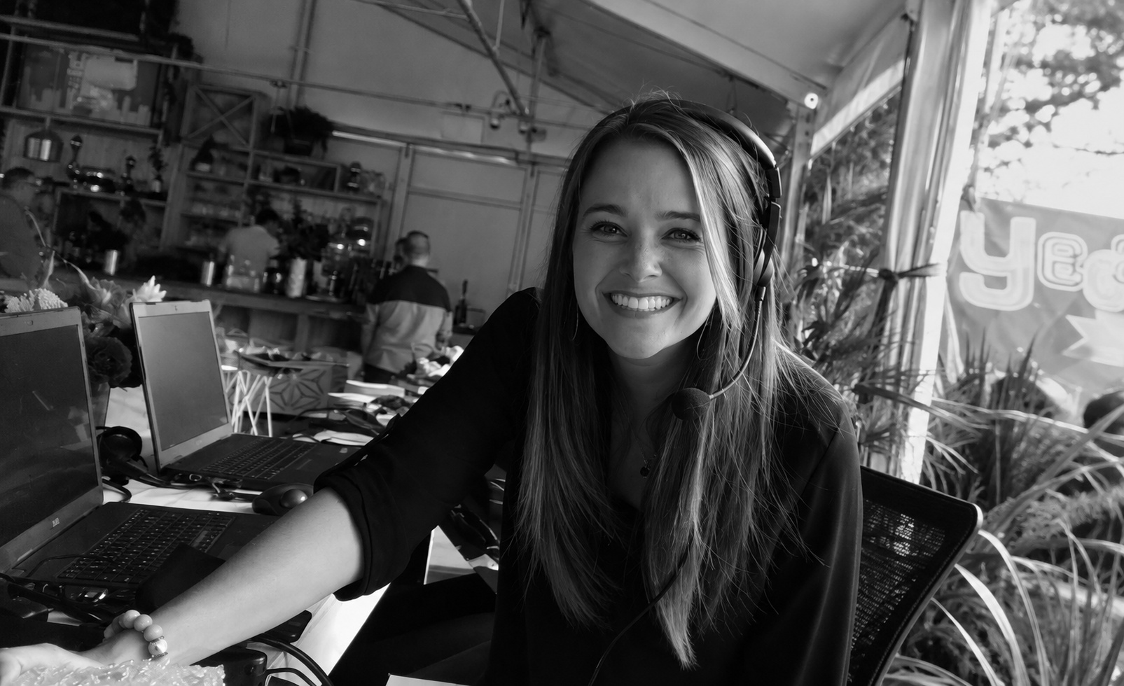 Lauren working on site wearing a headset